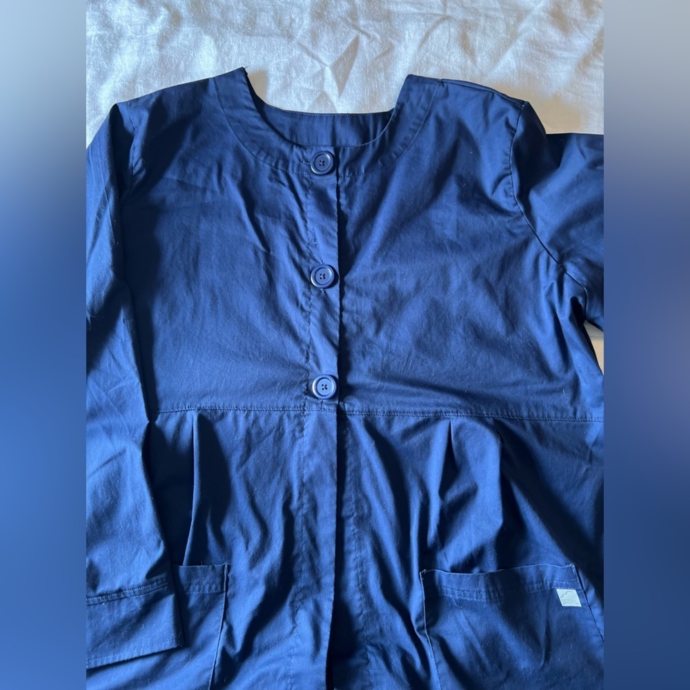 Butter Soft Stretch Dark Blue Scrub Jacket. Button up. Pleated.
